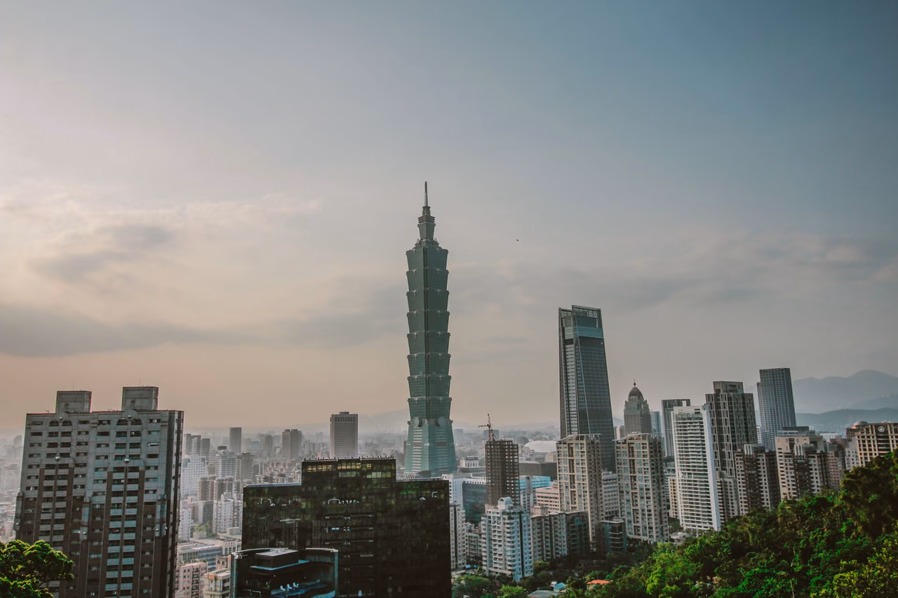 Taipei skyline on a clear day with the Taipei 101 tower rising above the surrounding buildings