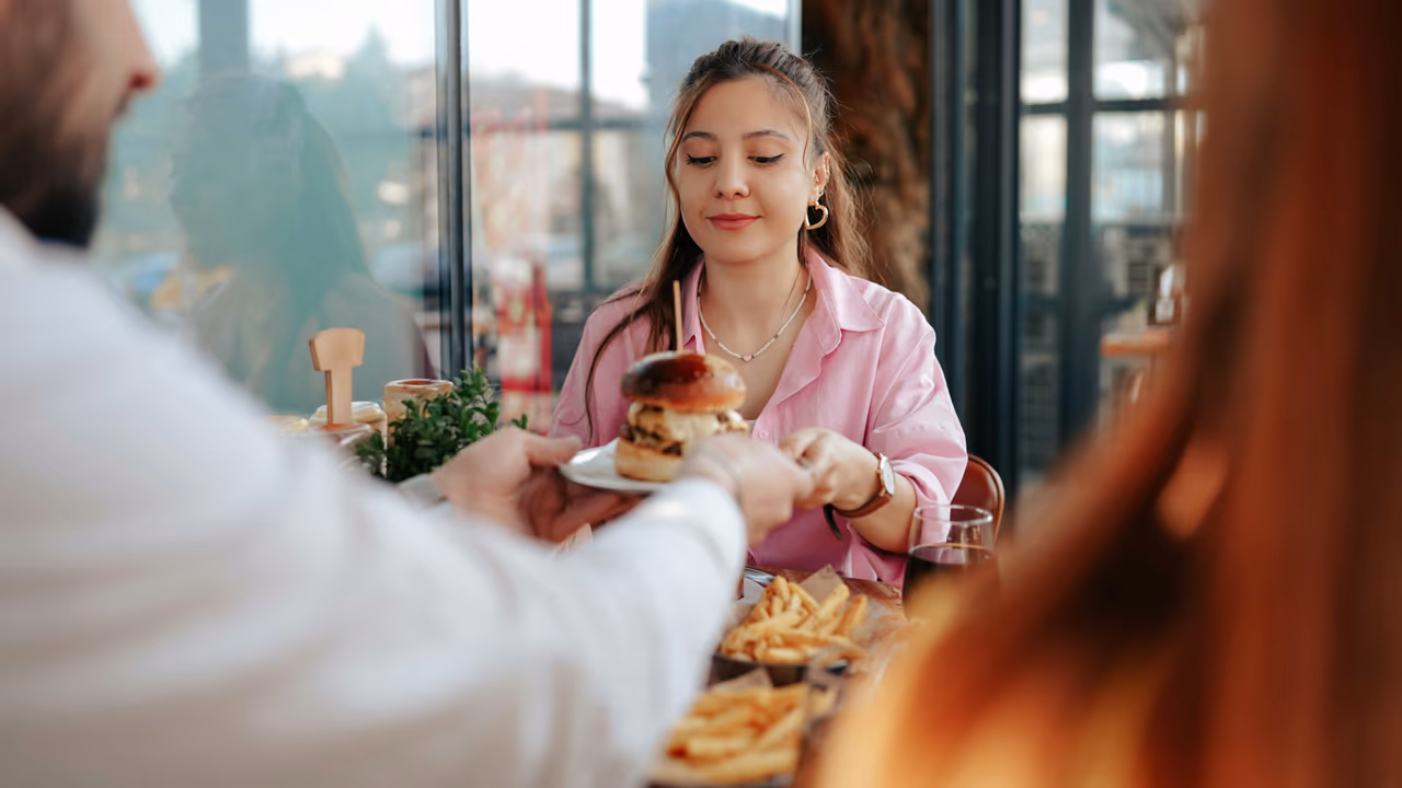 Woman dining at restaurant with friends