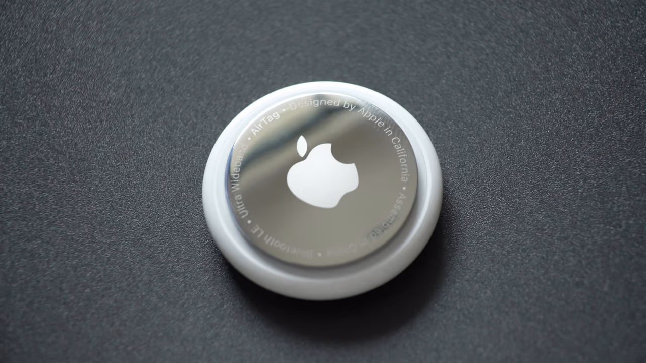 Apple AirTag on dark surface