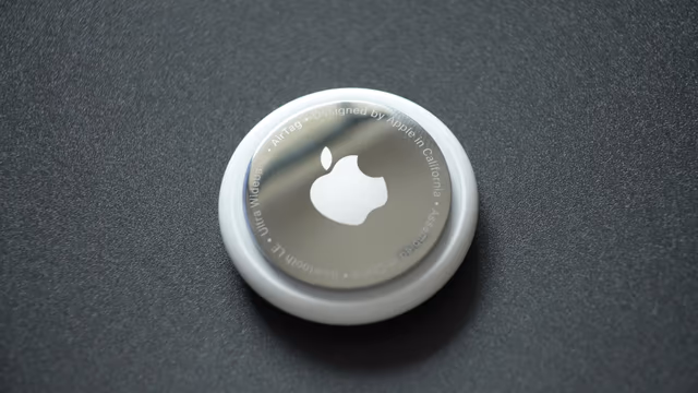 Apple AirTag on dark surface