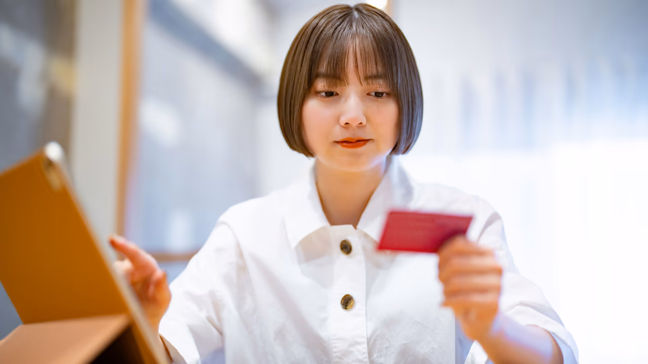 Woman shopping online with a credit card