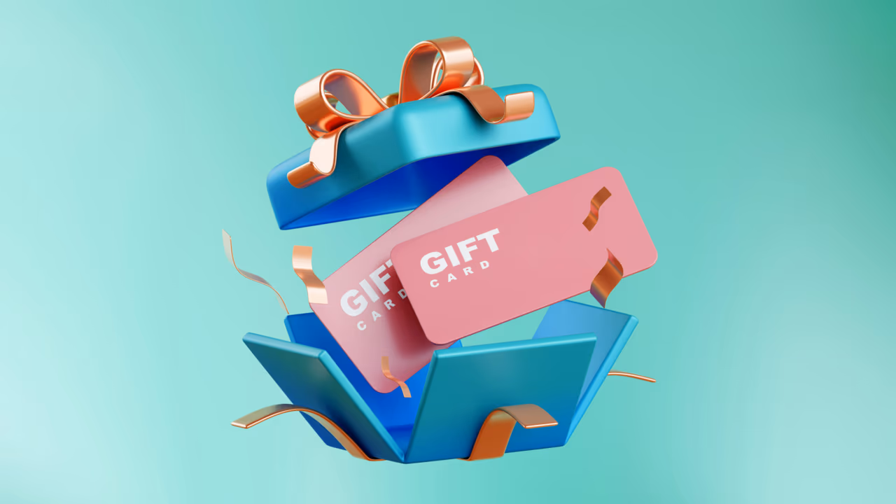 Gift cards popping out of a blue gift box
