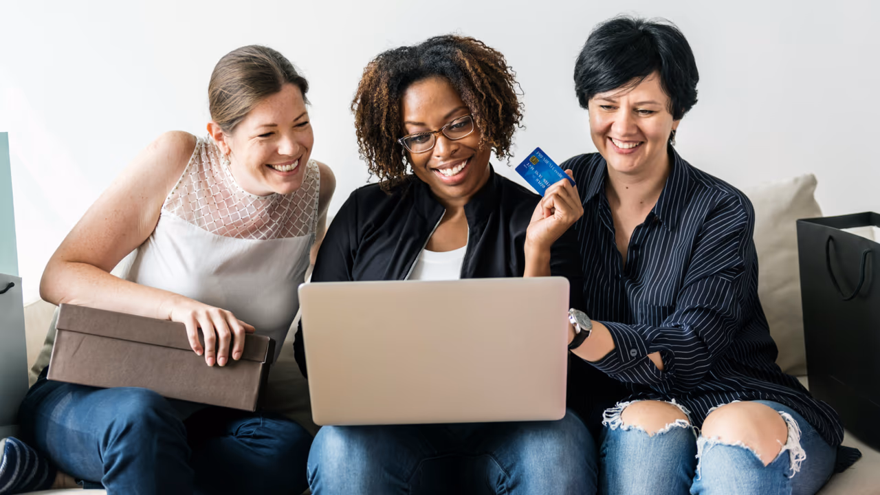 Women shopping online with laptop and card