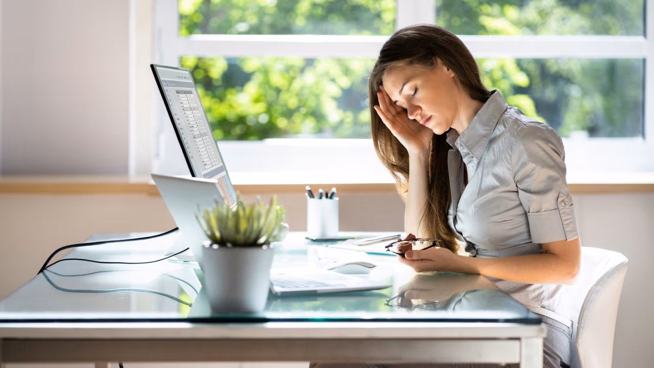 Stressed woman working at a desk