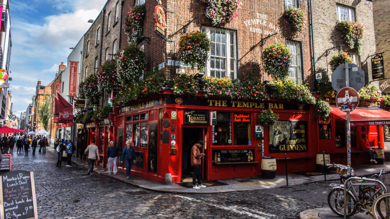 a street in dublin with a bar on the corner