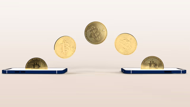 Gold bitcoin coins transferring through mobile phones