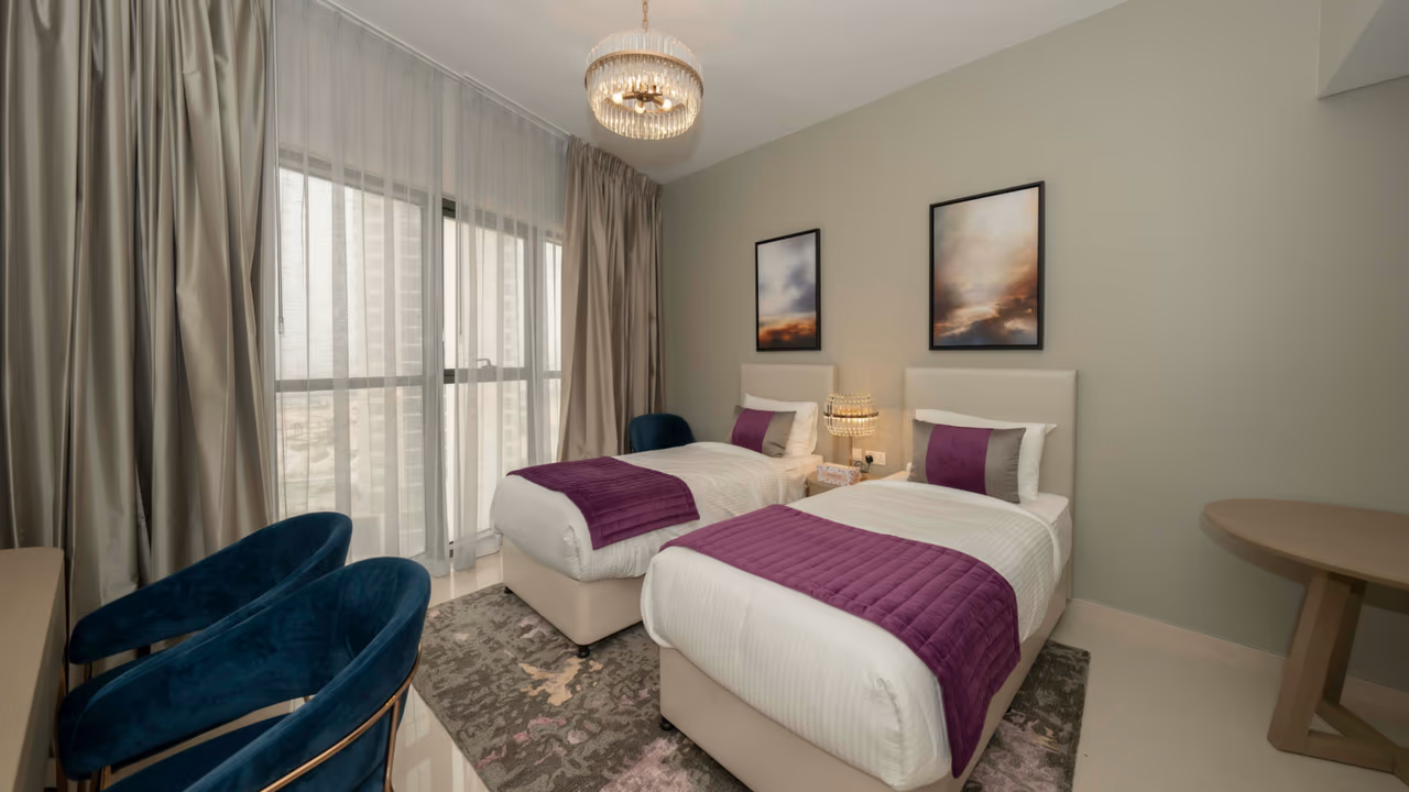 Modern hotel room with twin beds and elegant decor