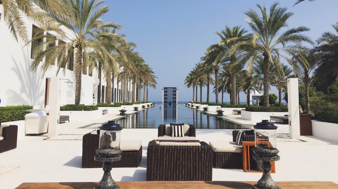 Luxury resort with palm trees and infinity pool