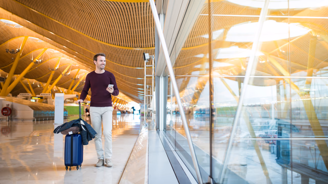 Traveler with luggage at airport