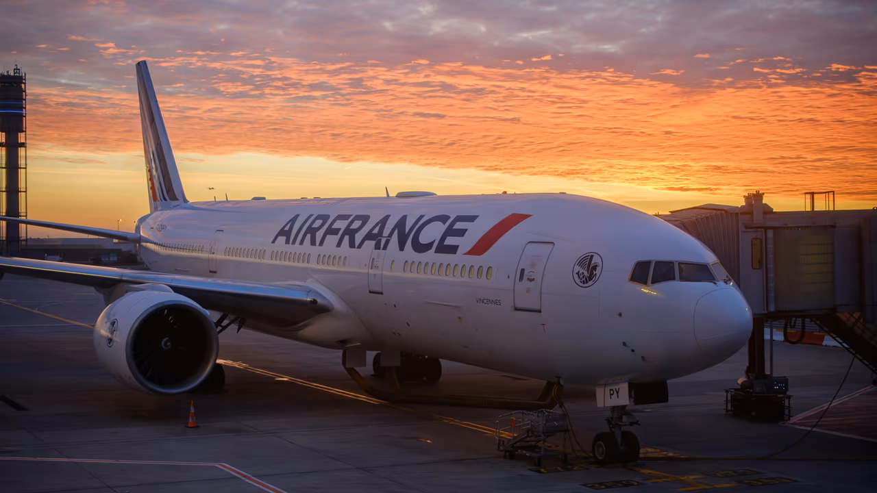 Air France plane at airport gate during sunset
