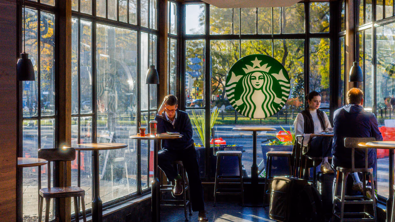 Starbucks store interior with customers and logo