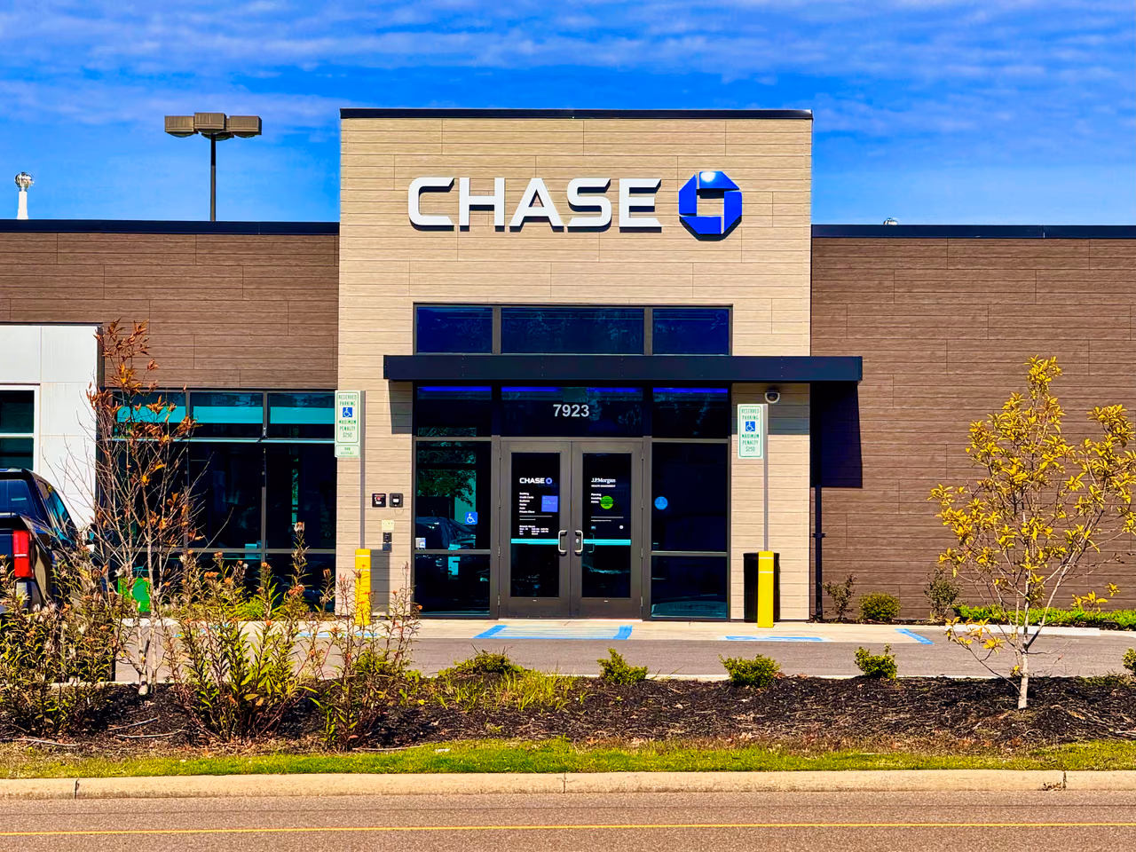 The entrance of a Chase bank branch in Knoxville, Tennessee, under a blue sky.