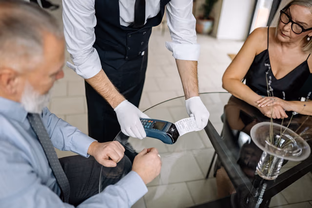 Airline and Hotel Dining Programs Compared: What Each Pays per Dollar and the One-Card Rule