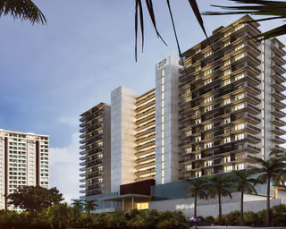 Guest room towers and entrance signage at Grand Hyatt Cancun Beach Resort, seen from the street at dawn