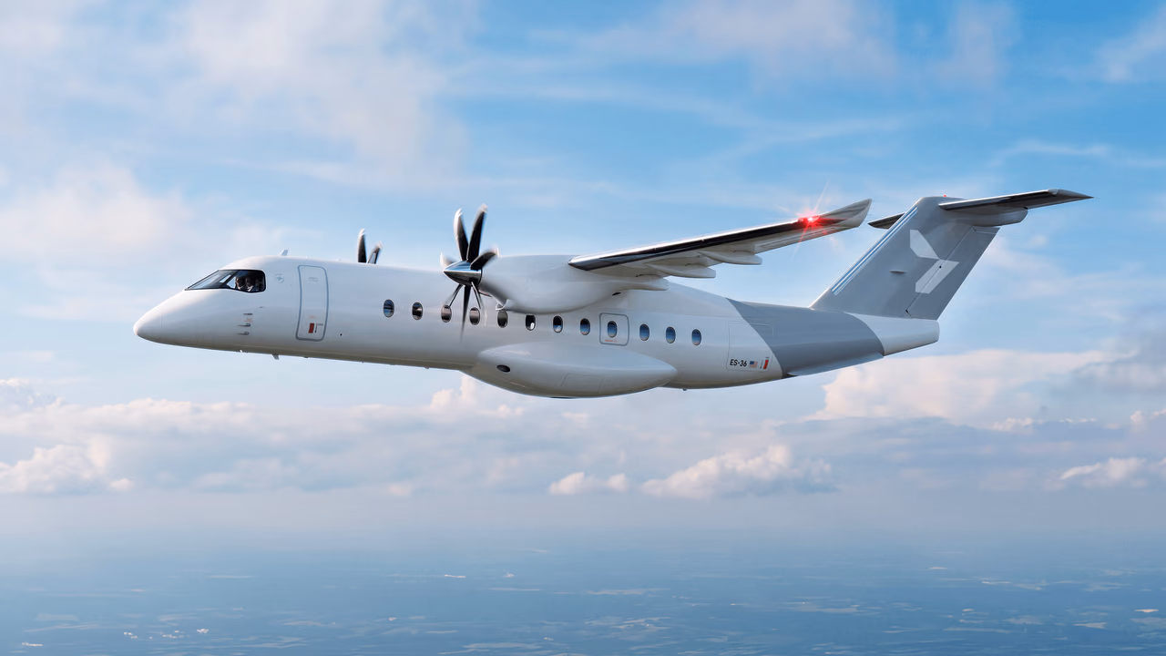 Rendering of a white twin-propeller Heart Aerospace ES-36 regional airliner flying above a layer of clouds