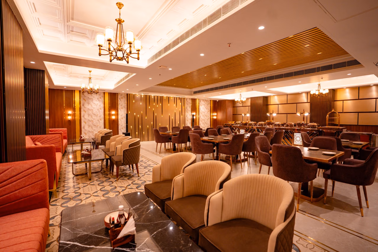 Restaurant dining room with chandeliers and plush seating